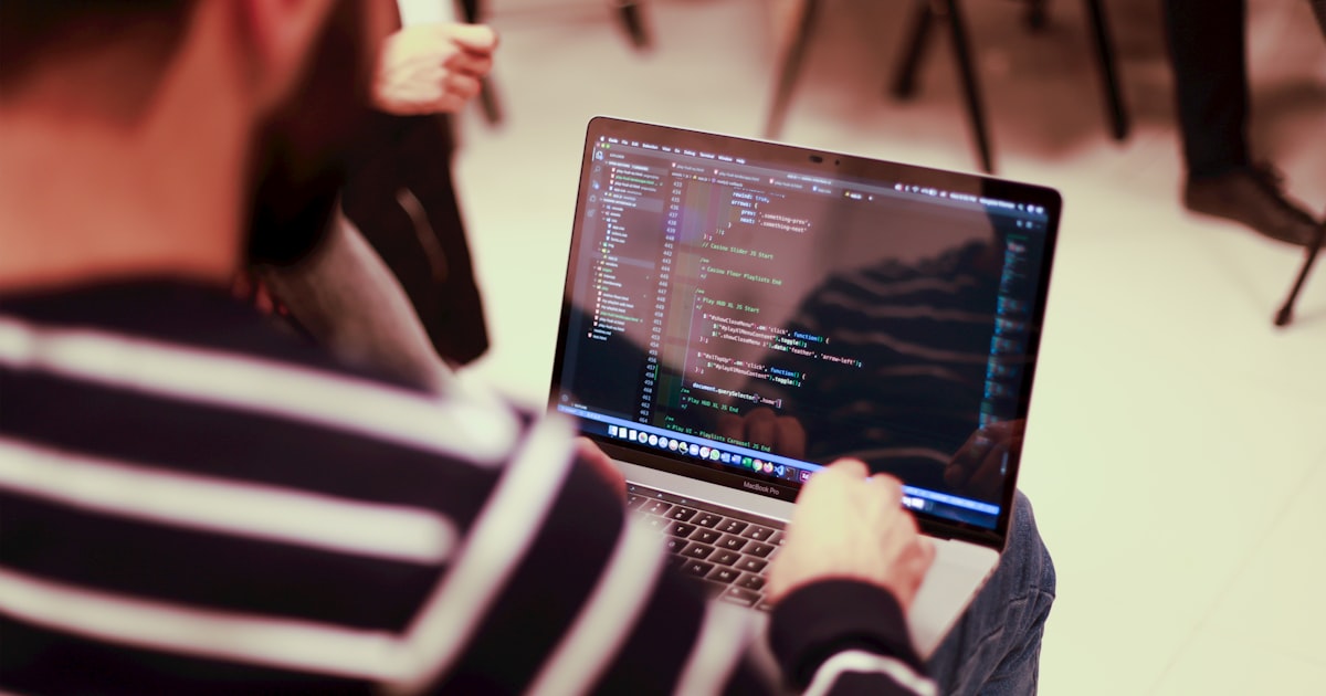 Developer building a platform at a laptop